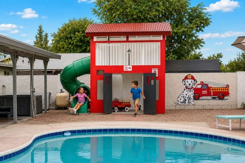 Fire-station themed kids’ play area — hours of backyard fun
