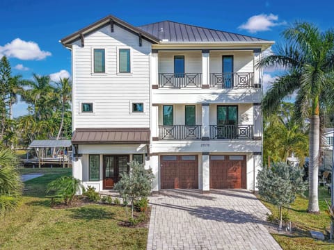 Dockside Dream - Dockside Dream is a stunning three story modern pool home on a canal with a private dock and Gulf Access, located 1.5 mile from Bonita and Barefoot Beach parking