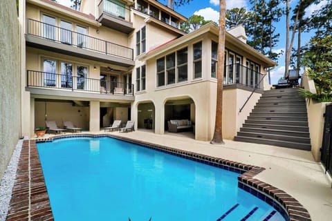 Private pool area at 26 Spinnaker Court with ample space for lounging and outdoor living, offering a resort-style setting just moments from Harbour Town in Sea Pines.