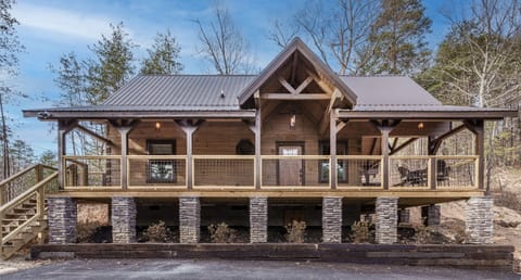 Custom built with real logs,enjoy the privacy from the large wrap-around deck.