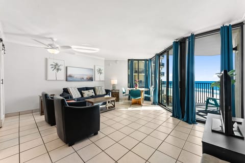spacious living room with ocean views and natural light