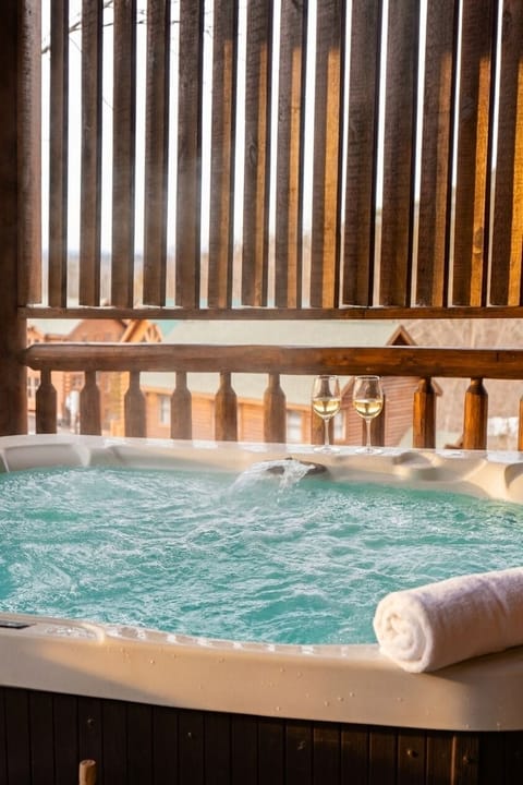 Melt the day away in your own covered, private hot tub.