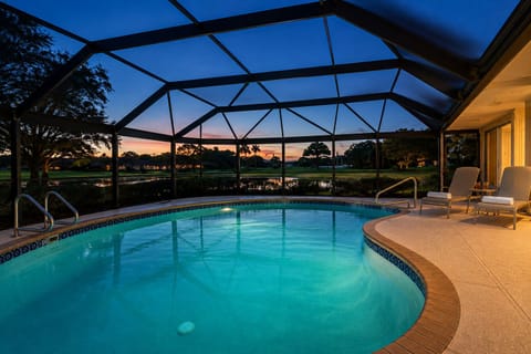 Unwind by your private illuminated pool at dusk, Lake & PGA golf course views.