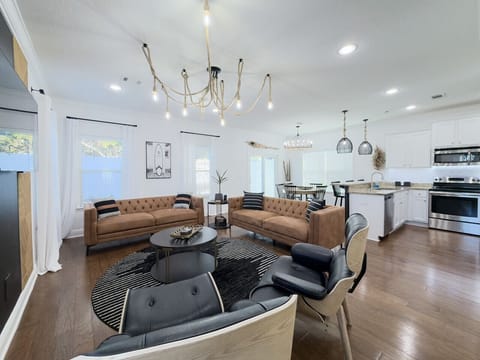 Living room modern seating, stylish lighting, and a smart TV for ultimate comfort