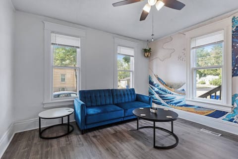 Unwind on the plush sofa with a good book and a warm drink while natural light streams through the windows.