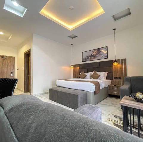 Deluxe Room, Balcony, City View | Desk, laptop workspace, blackout drapes, soundproofing
