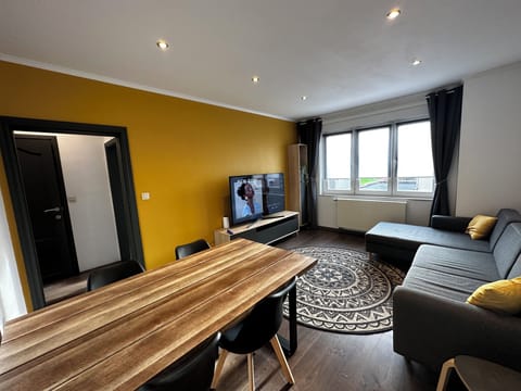 Comfort Apartment, Garden View | Living area | Flat-screen TV