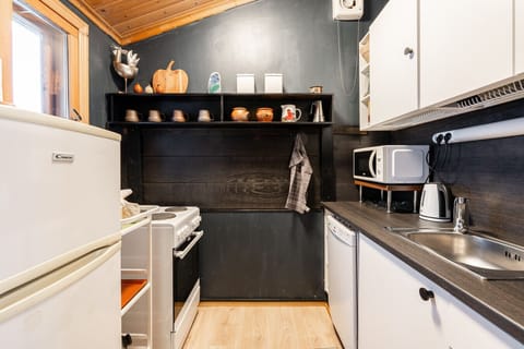 The modern kitchen is fully equipped with all essential appliances and cookware, making it easy to prepare anything from quick breakfasts to full meals.