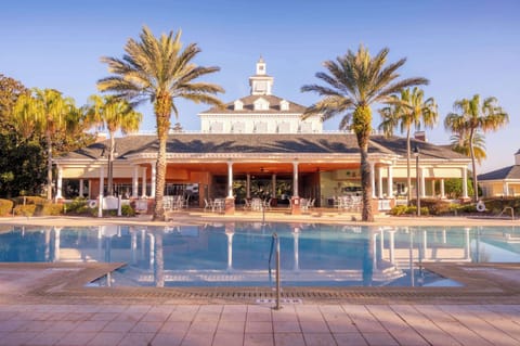 
A peaceful sunrise reflecting over the Reunion Resort pool.