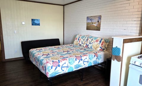 #103 is a studio with a queen bed and futon that sleeps two children