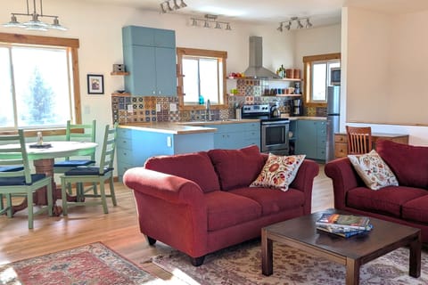 The open living space is uncluttered and serene, but full of color.