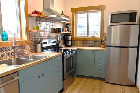 Talavera tile backsplash and birch butcherblock counters.