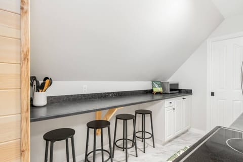 Spacious kitchen bar with seating for four, perfect for casual dining or working remotely.