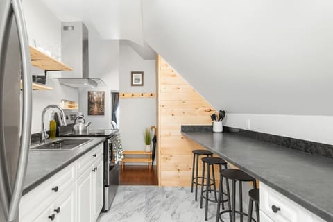 Bright kitchen with modern appliances and a convenient layout, making meal preparation a breeze.