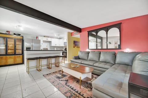 Open-concept living with fully equipped kitchen and cozy lounge seating