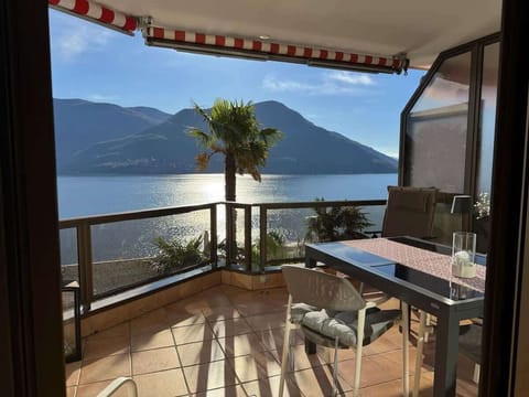 Private balcony with seating and panoramic views of Lake Maggiore