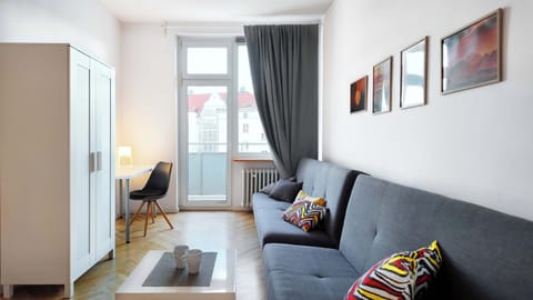 A stylish, bright interior with a grey sofa.