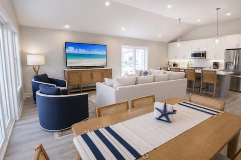 
Modern coastal living space with comfortable seating and an open layout, designed for relaxation and quality time together.