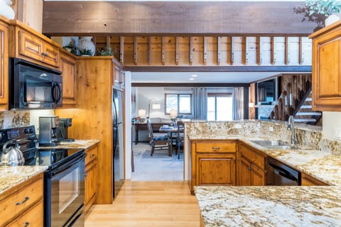 Your fully equipped kitchen features granite countertops and modern appliances, perfect for preparing meals during your stay.