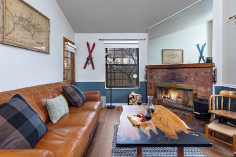 Sink into the leather sofa beside your crackling fireplace.