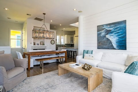 Sink into plush seating and admire the ocean artwork while enjoying the bright, airy living space with its warm wood accents.