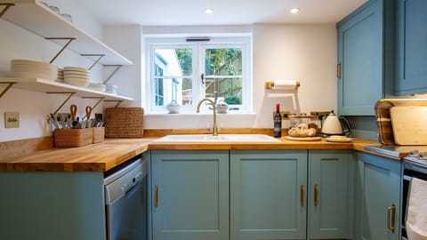 Overlooking the garden, you have a delightful view while preparing meals.