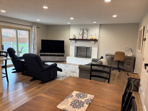 Family Room with Sony 65 inch Oled Smart TV & Fireplace With Electric Logs Set