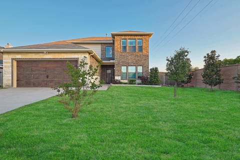Modern two-story retreat with a spacious yard and stylish curb appeal—perfect for your next group getaway.