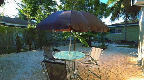 Sip your morning coffee or evening cocktail under a shaded umbrella surrounded by lush Bahamian fauna with seating for 3..
