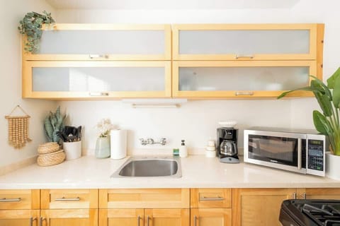 The charming kitchen comes fully equipped for your stay