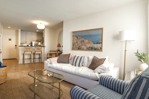 Bright, open living area with comfortable seating and an open-concept layout — perfect for relaxing or entertaining