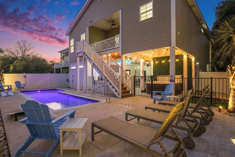Welcome to Sea Princess: your heated private pool awaits under glowing twilight string lights, just steps from Myrtle Beach's sandy shores.