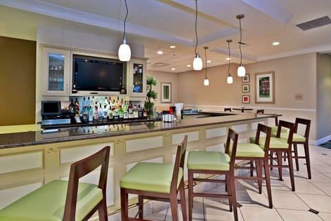 Bar area with counter seating and hanging lights
