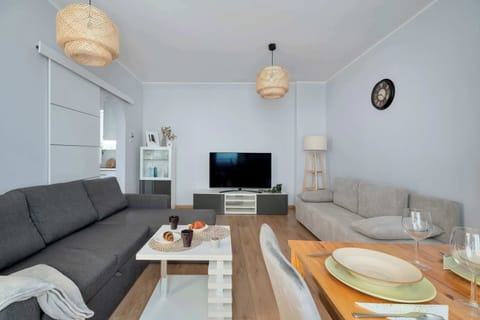 Relax in the stylish living room with two comfortable sofas and cosy decor.