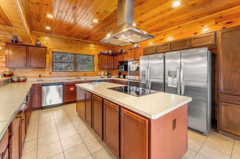 Gourmet kitchen featuring dual refrigerators and professional stainless appliances.