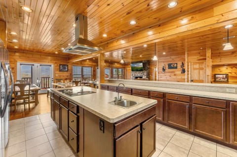 Gourmet kitchen featuring dual refrigerators and professional stainless appliances.