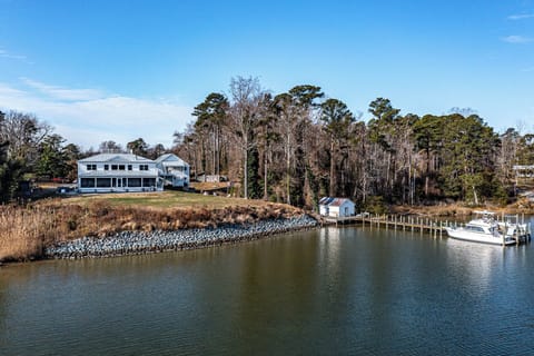 My modern homestead with a pool, jacuzzi, firepit, and dock access. 