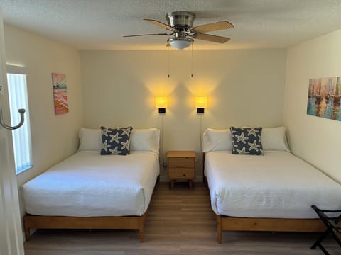 Laptop workspace, iron/ironing board, cribs/infant beds, bed sheets