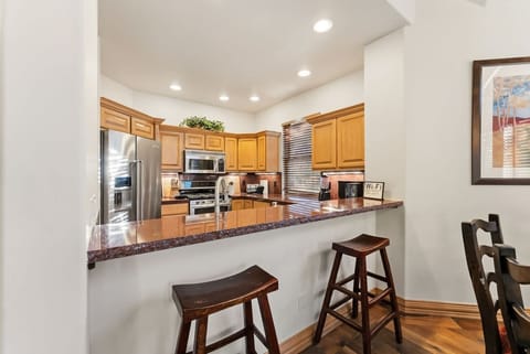 Fully equipped kitchen with bar seating