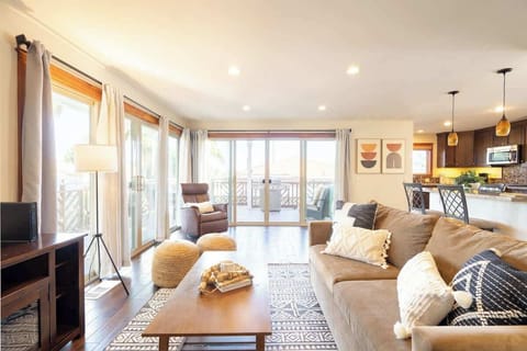 Slide open the double glass doors and let the cool ocean breeze inside