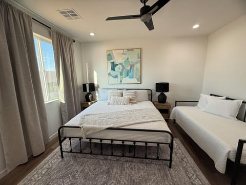 Master bedroom with king bed and twin daybed