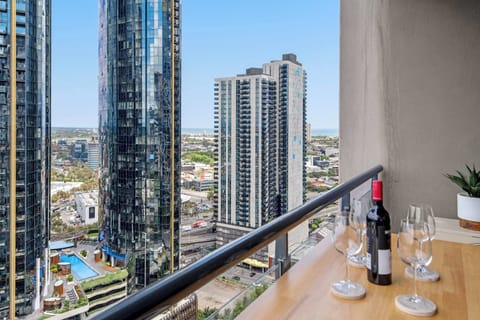 This expansive corner balcony offers a unique, wide-angle perspective of the city’s most iconic architectural landmarks and bustling streets.