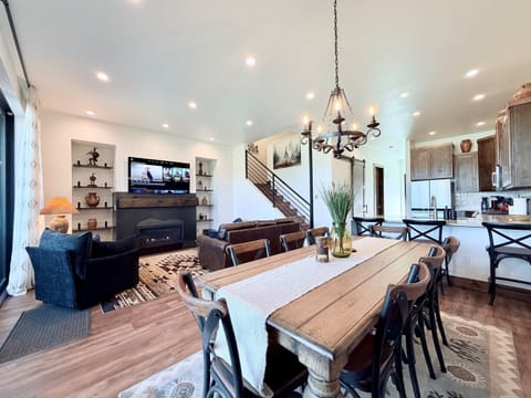 1) Open-concept dining area with large table, seamlessly connected to the kitchen and living room—ideal for group meals and gatherings.
