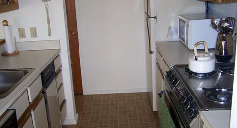 Fully equipped kitchen with modern appliances, providing everything you need to prepare delicious home-cooked meals.