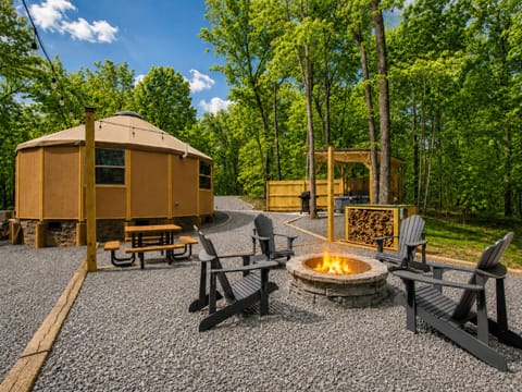 Firepit and outdoor seating area — perfect for evenings under the trees