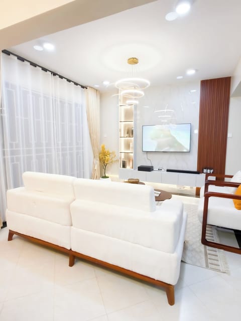 Family Apartment, Balcony, City View | Living area | Flat-screen TV