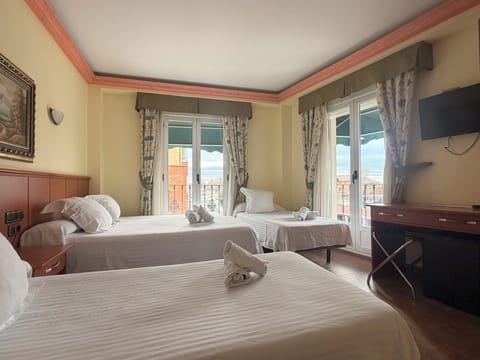 Quadruple Room, Balcony, City View | Desk, laptop workspace, free WiFi