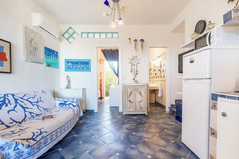 Apartment, Sea View | Living area | Flat-screen TV