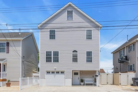 Front exterior with parking for 4 cars in driveway