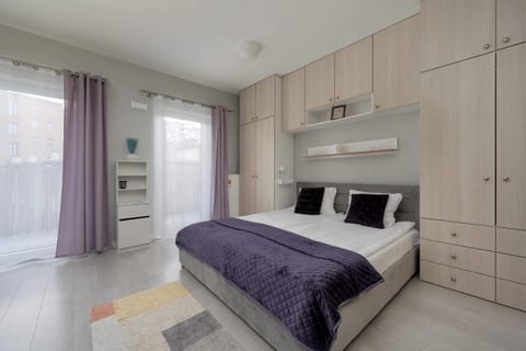 A bright space with a comfortable bed and built-in storage encourages relaxation and keeps things tidy.